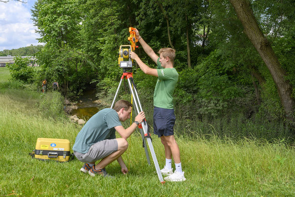 July 3, 2019; Student interns with the Center for Civic Innovation and Bowman Creek Educational Ecosystem, Finn Cavanaugh and Tommy Crooks (right) from Notre Dame survey an area of Bowman Creek in South Bend. (Photo by Barbara Johnston/University of Notre Dame) Copyright University of Notre Dame
